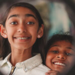 two girls smiling